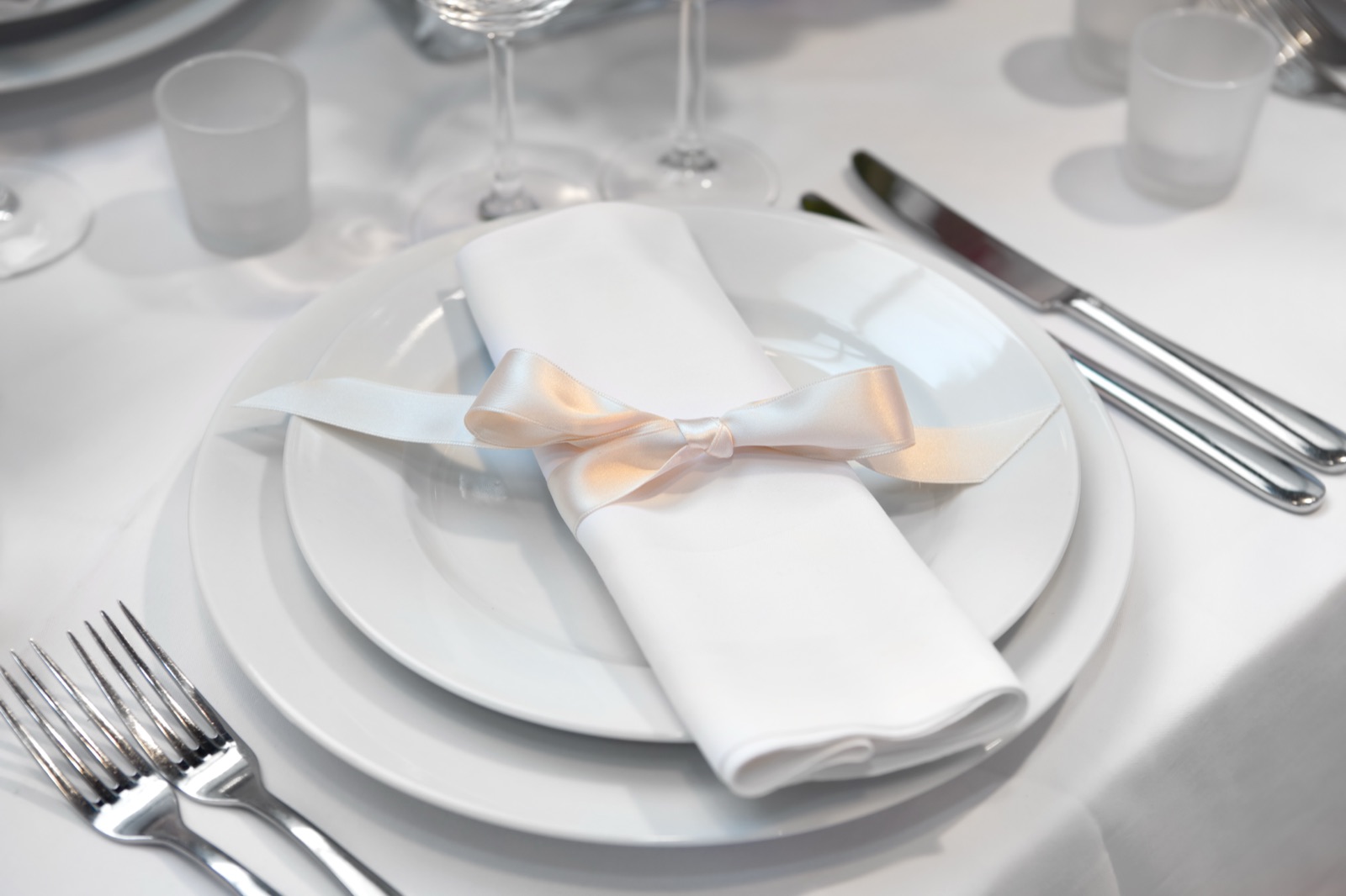 Linen, glassware, and a place setting for a Something Different catered event